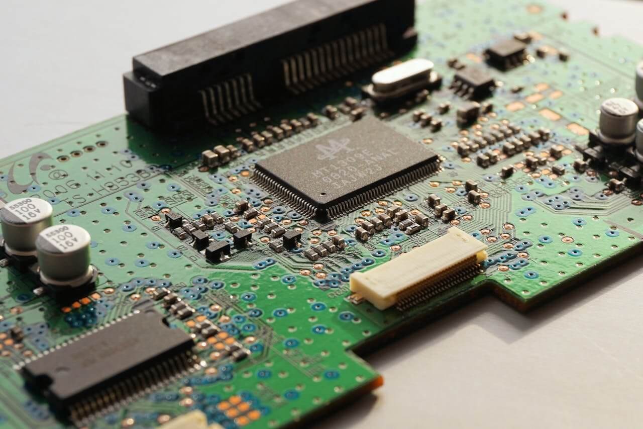 Close-up of a ceiling fan controller PCBA and electronic components